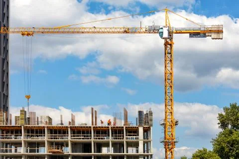 Construction of a multi-storey residential building using a tower crane again Stock Photos