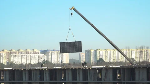 Construction of a multistorey monolithic residential complex, with workers Stock Footage 116486889
