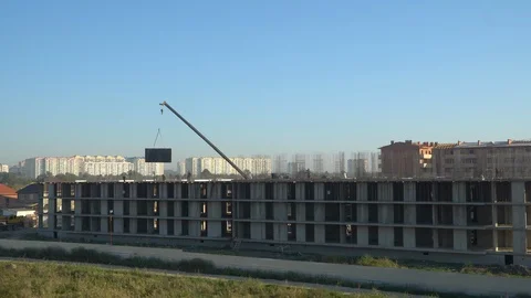 Construction of a multistorey monolithic residential complex, with workers Stock Footage 116487800