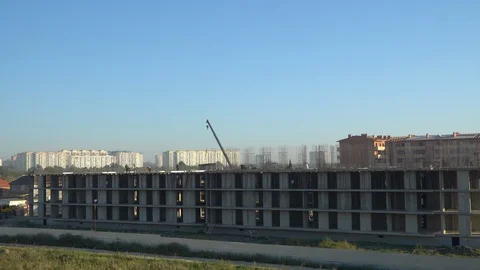 Construction of a multistorey monolithic residential complex, with workers Stock Footage 116488209