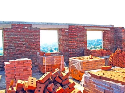 Construction of a multistory building. Brick and walls and ceilings of the un Stock Photos