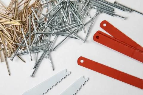 Construction nail stack and blades for sawing metal Stock Photos