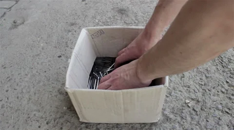 Construction nails in his hands Stock Footage 62922635