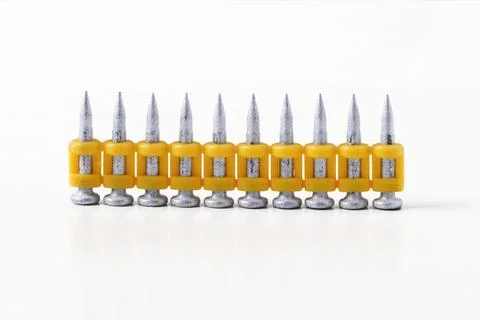 Construction nails for a pistol Stock Photos