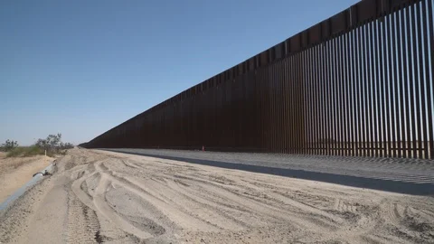 Construction of new border wall is underway on the US-Mexico border. Stock Footage 122111223