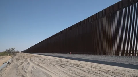 Construction of new border wall is underway on the US-Mexico border. Stock Footage 122113553