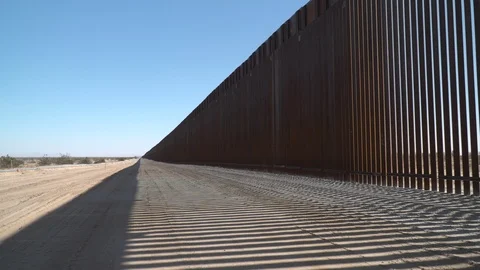 Construction of new border wall is underway on the US-Mexico border. Stock Footage 122113720