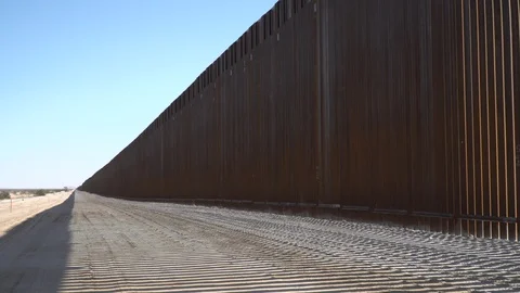 Construction of new border wall is underway on the US-Mexico border. Stock Footage 122116460