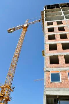 Construction of new building with attached crane Stock Photos