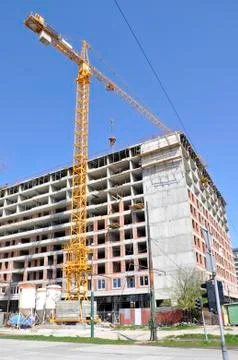 Construction of new building with attached crane Stock Photos