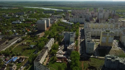 Construction of a new building from panels and building cladding in summer synny Stock Footage 230356475