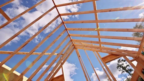 Construction of new building structure with wooden beams roofing framing Stock Footage 336040599