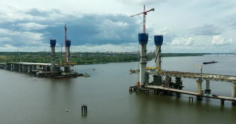 Construction of a new cable-stayed bridge across the river Stock Footage 159637996