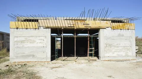 Construction of a new garage. the building is missing a gate and a roof Stock Photos