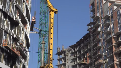 Construction of a new high-rise building on a sunny day. Facade of new apartment Stock Footage 126005758