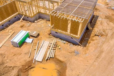 Construction of a new home under construction, wooden beams framing roof wall of 스톡 사진