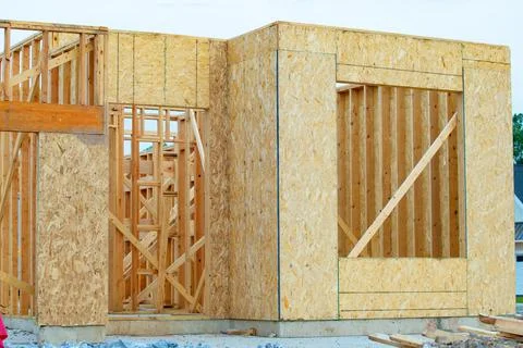 Construction of new house wall frame plywood timber plank Stock Photos