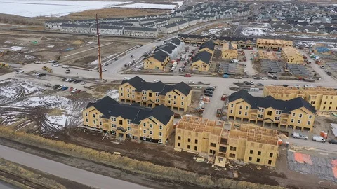 Construction of new housing development taking over empty land Stock Footage 123168493