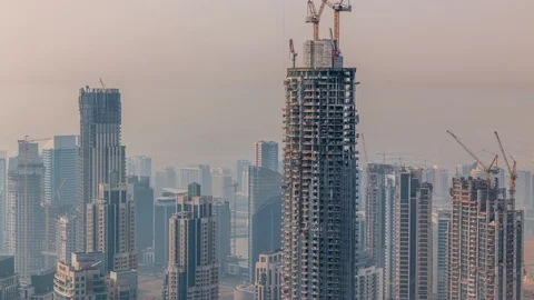 Construction of new modern skyscraper in Dubai city aerial timelapse, United Stock Footage 113828334
