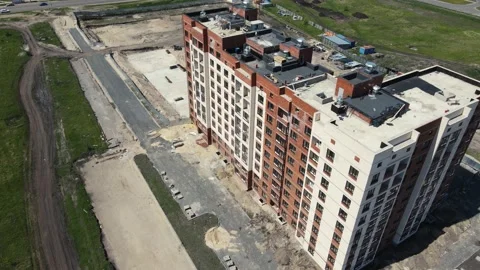 Construction of a new multi-storey building in a new area. drone shooting Video stock 155848643