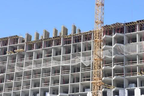 Construction of new residential high-rise buildings. Against the background.. Stock Photos