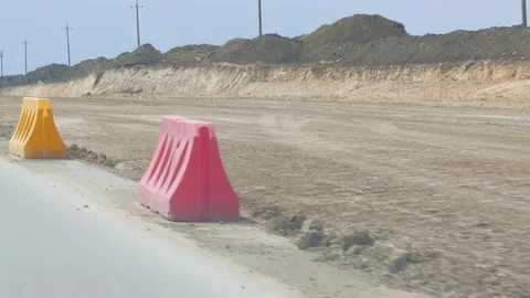 Construction of a new road along which the barriers are being repaired 스톡 동영상 92741666