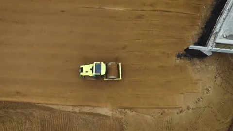 Construction of a new road on the bridge. The machine aligns the ground Moscow Stock Footage 97786376