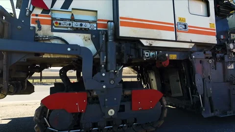 Construction of a new road. Large white asphalt paver on the road Stock Footage 98085037