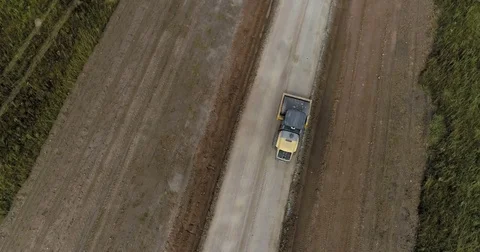 Construction of a new road in the middle of a field Stock Footage 79926683