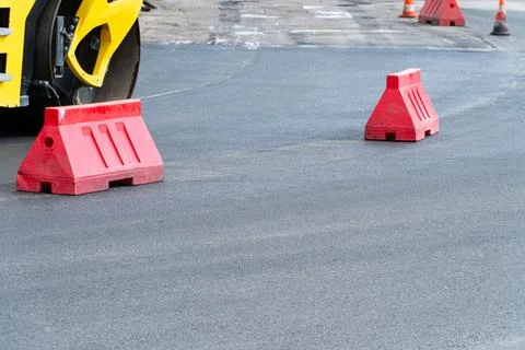 Construction of a new road. Road roller working on the new road construction. 库存照片