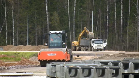 Construction of a new road. Special large machines at the construction site Stock Footage 95186877