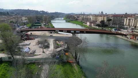 Construction of the new tram bridge over the Arno River. Stock-Footage 330676548