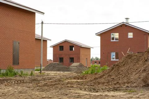 Construction of new two-storey brick houses. Stock Photos