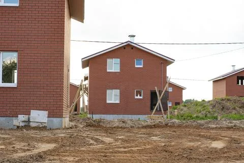 Construction of new two-storey brick houses. Stock Photos