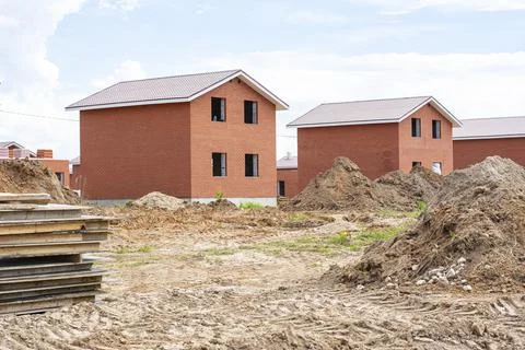 Construction of new two-storey brick houses. Urban-type settlement. Stock Photos