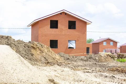 Construction of new two-storey brick houses. Urban-type settlement. Stock Photos