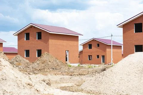 Construction of new two-storey brick houses. Urban-type settlement. Stock Photos