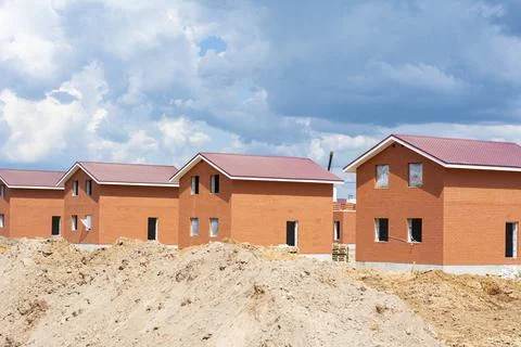 Construction of new two-storey brick houses. Urban-type settlement. Stock Photos