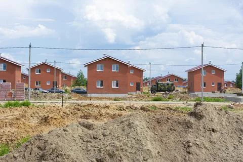 Construction of new two-storey brick houses. Urban-type settlement. Stock Photos