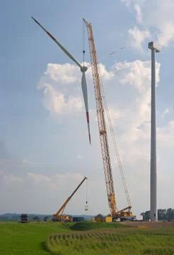 Construction of a new wind turbine in flat landscape. Stock Photos