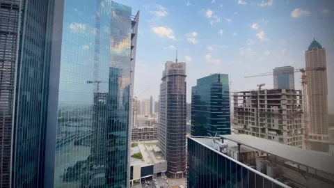 Construction next to modern towers Stock Footage 245852791