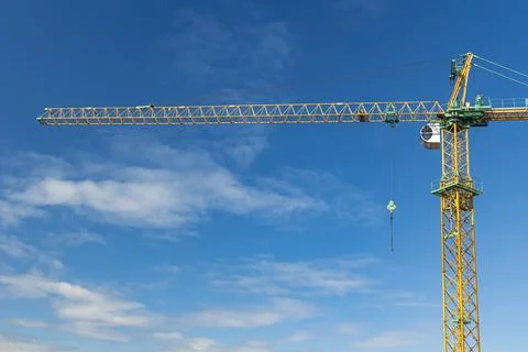 Construction object high building crane on blue sky background simple industr Stock Photos