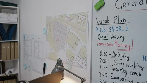 Construction Office Interior with Blueprints and Working Plan on Whiteboard Stock Footage 329624616