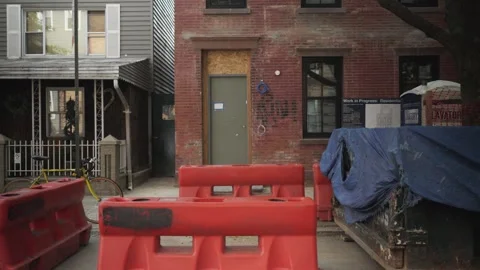 Construction on an old red brick brownstone Stock Footage 243811326