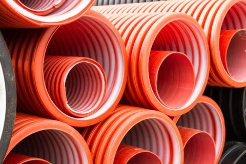 Construction orange and black plastic pipes Stock-Fotos