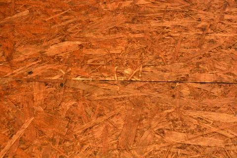 Construction oriented chipboard covered with brown varnish, original woody Stock Photos