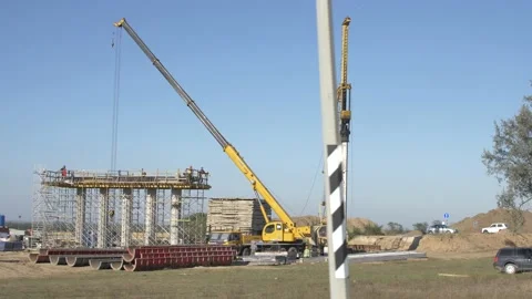 Construction of an overpass over the highway. Installation of piles. Stock Footage 151153096