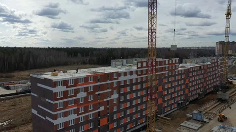 Construction of a panel apartment building on the edge of the city Stock Footage 128118523