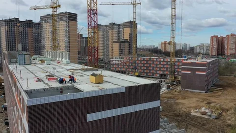 Construction of a panel apartment building on the edge of the city Stock-Footage 128119230