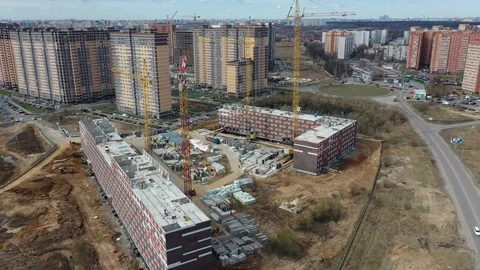 Construction of a panel apartment building on the edge of the city Stock-Footage 128119533